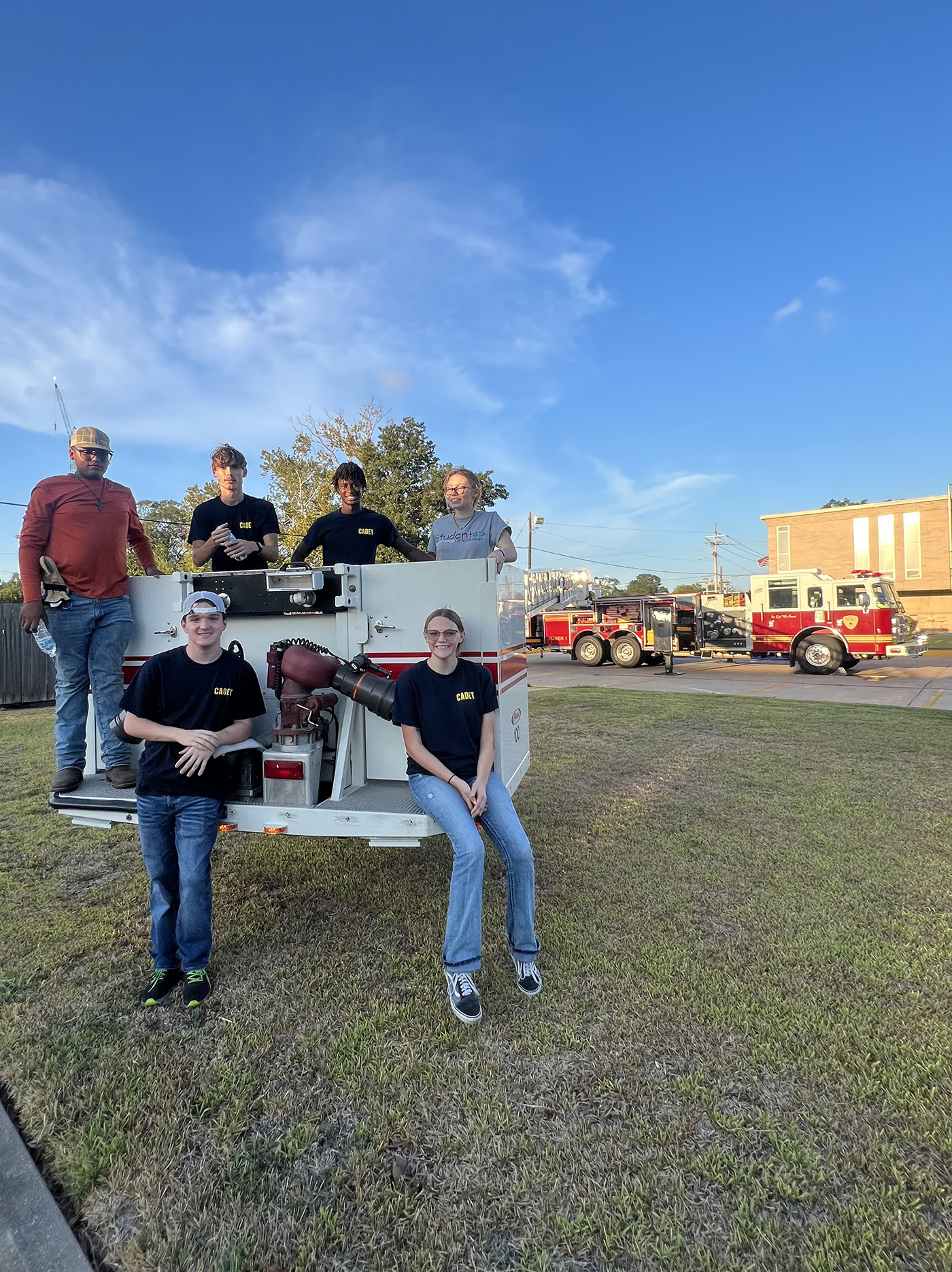 Angleton Cadets on a firetruck ladder AVFD Junior Cadet members pose on the end of a firetruck ladder.