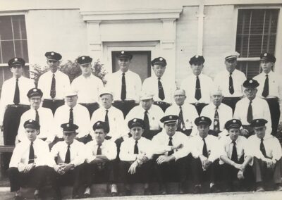 Our history on display as firefighters from long ago pose in white shirts and ties.
