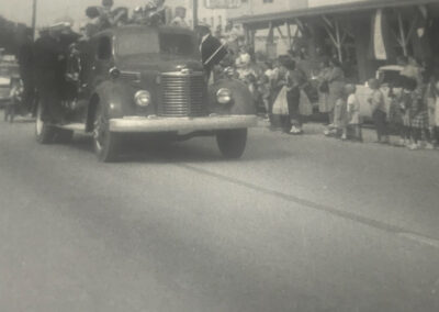An Angleton Volunteer Fire Department firetruck in a parade from long ago to highlight our history.