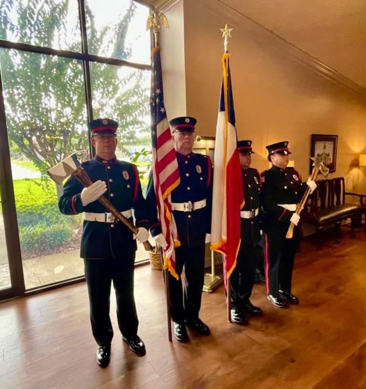 Angleton Volunteer Fire Department firefighters standing at attention dressed in official uniforms