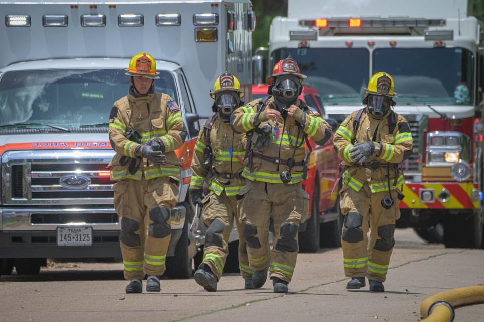 Career firefighters responding. Career firefighters answering to an emergency call.